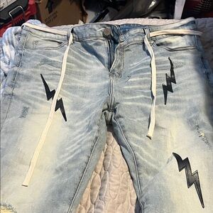Light Blue THRT Distressed Jeans with Black Lightning Bolts
